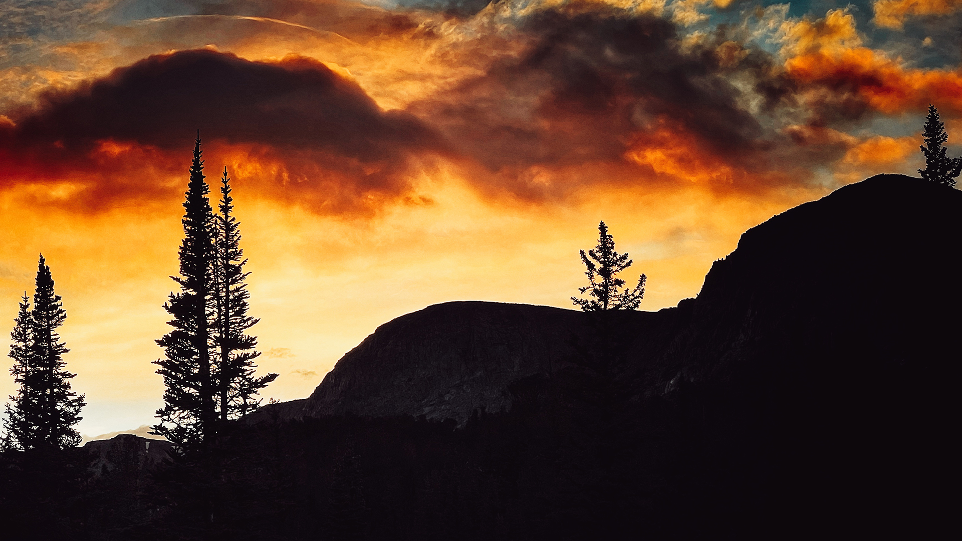 a red and yellow sky set in the wind river wilderness