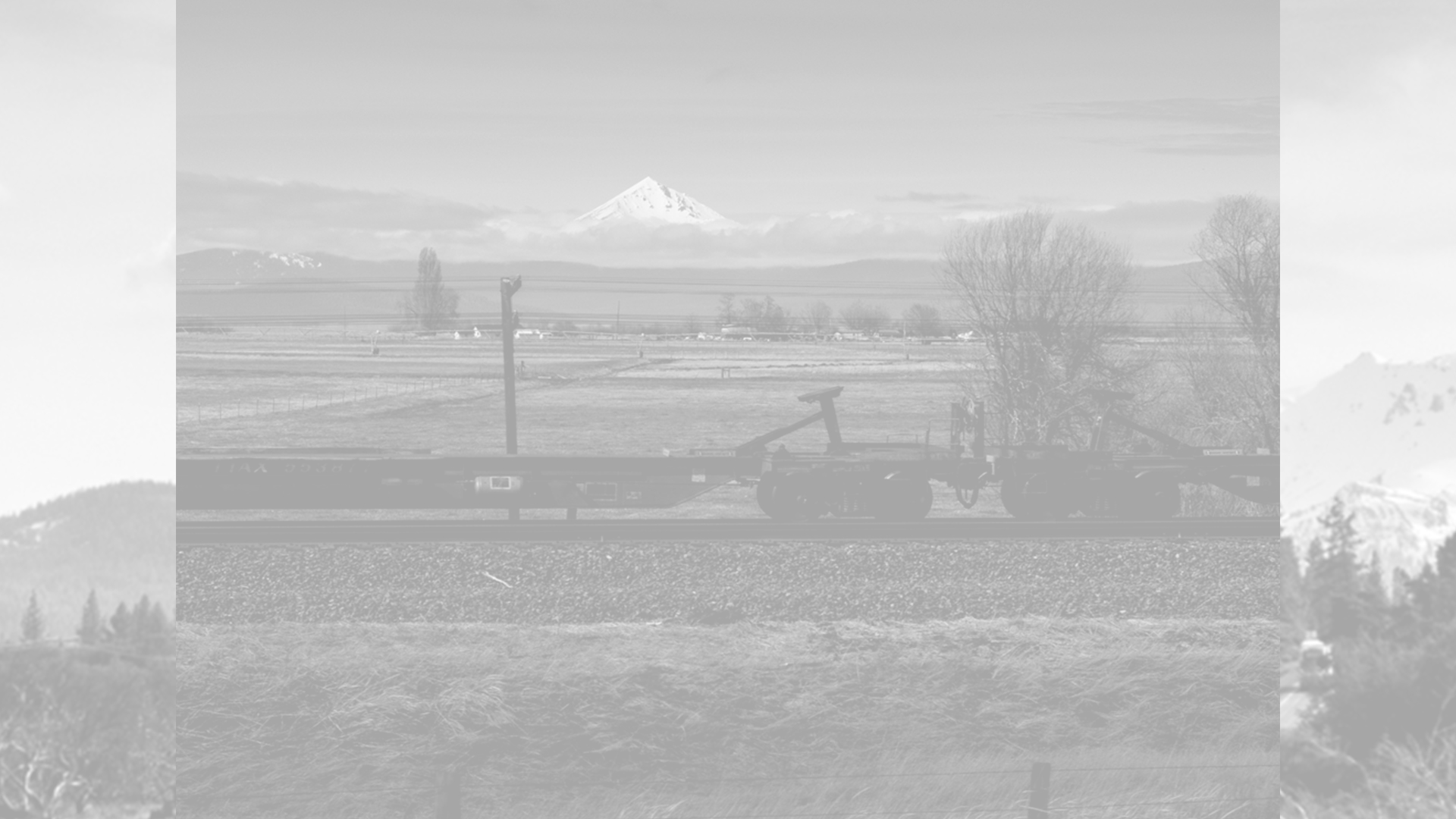 mount shasta as seen by the state of jefferson, train cars, black and white